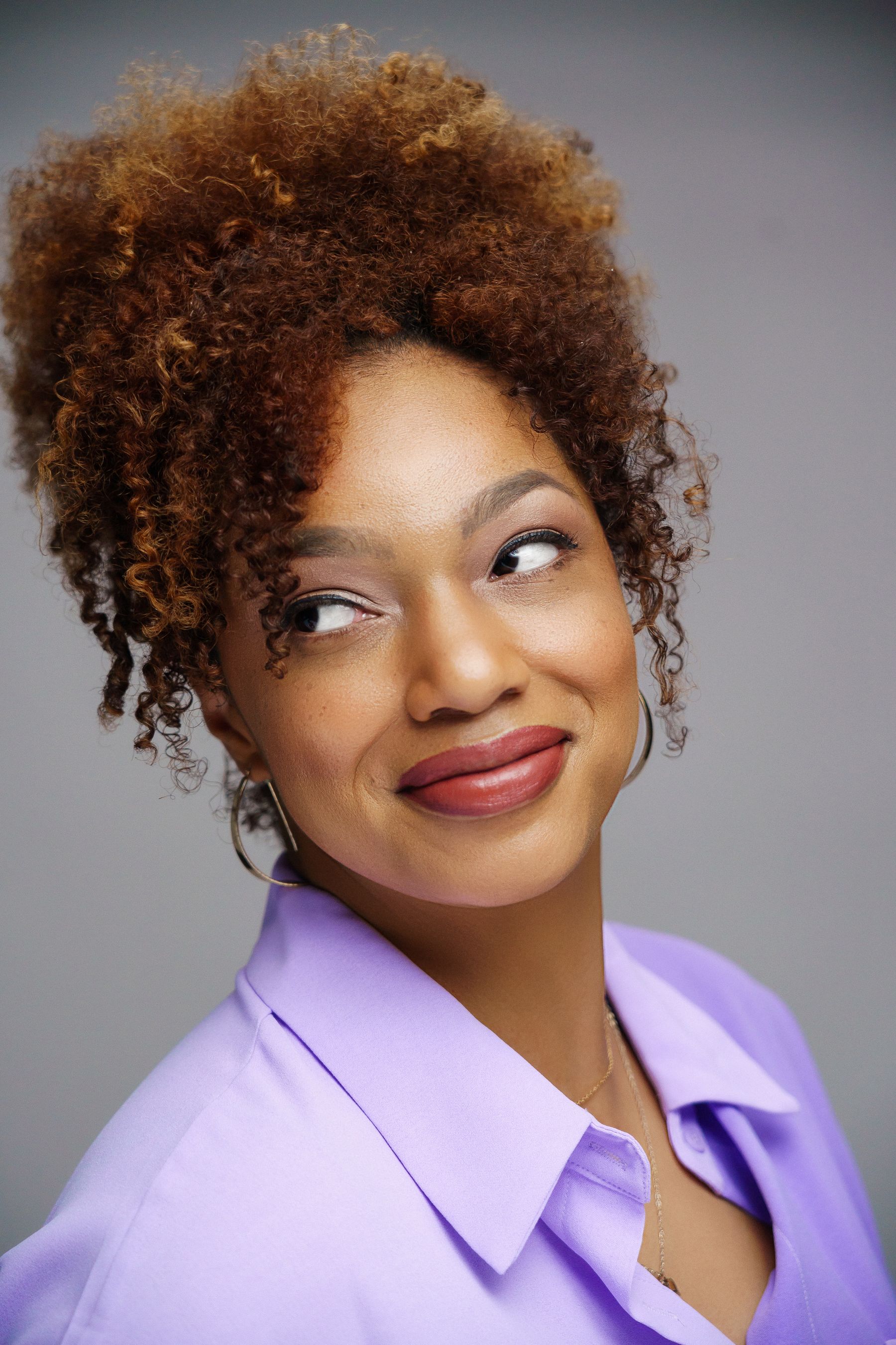 Smiling woman with styled curly hair